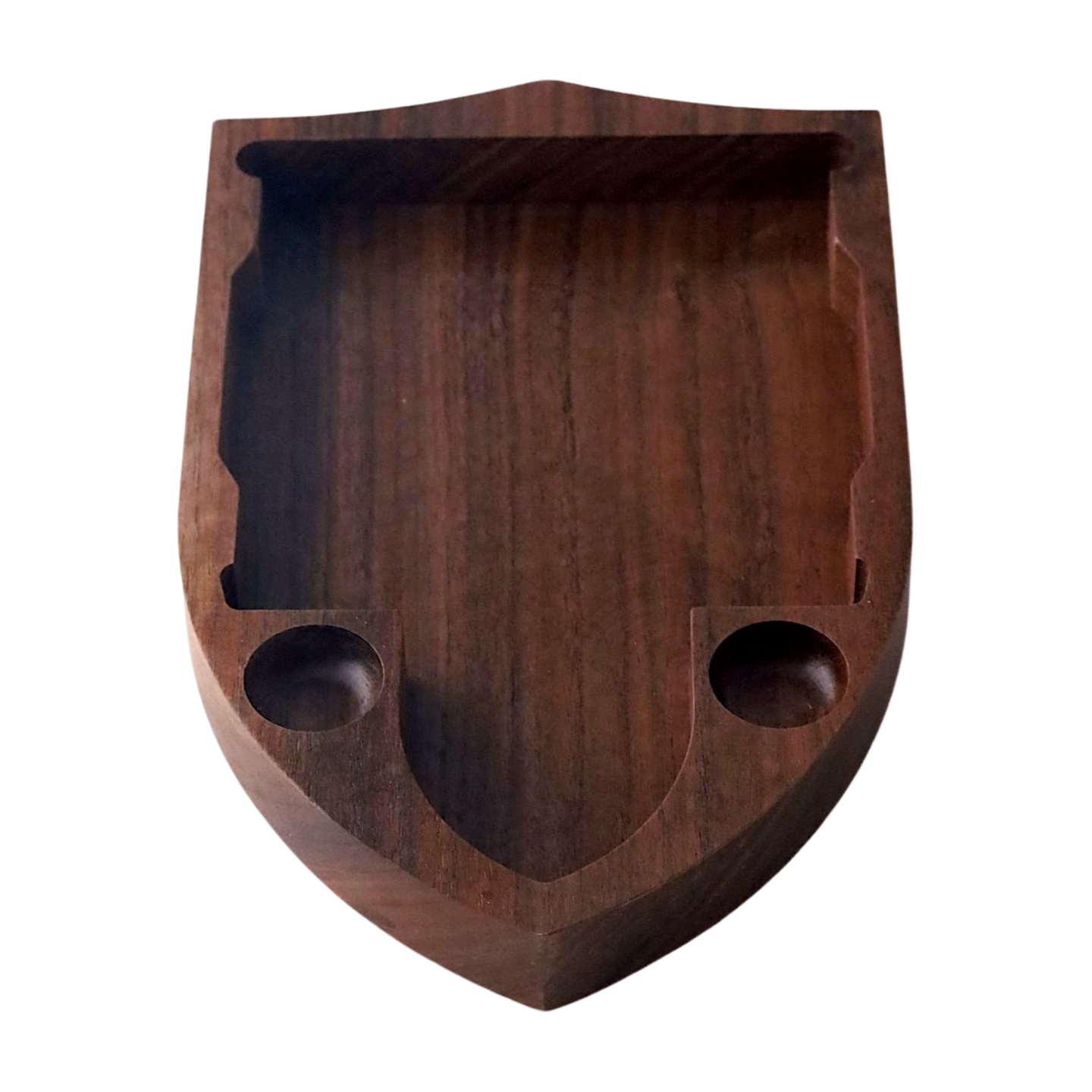 Wooden shield-shaped tray with two circular indentations for dice on a white background