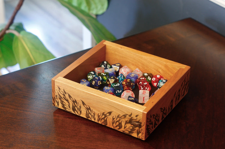 Cherry dice tray with flame design full of dice for DnD