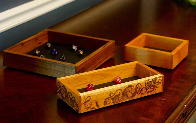 Three dice trays on a table