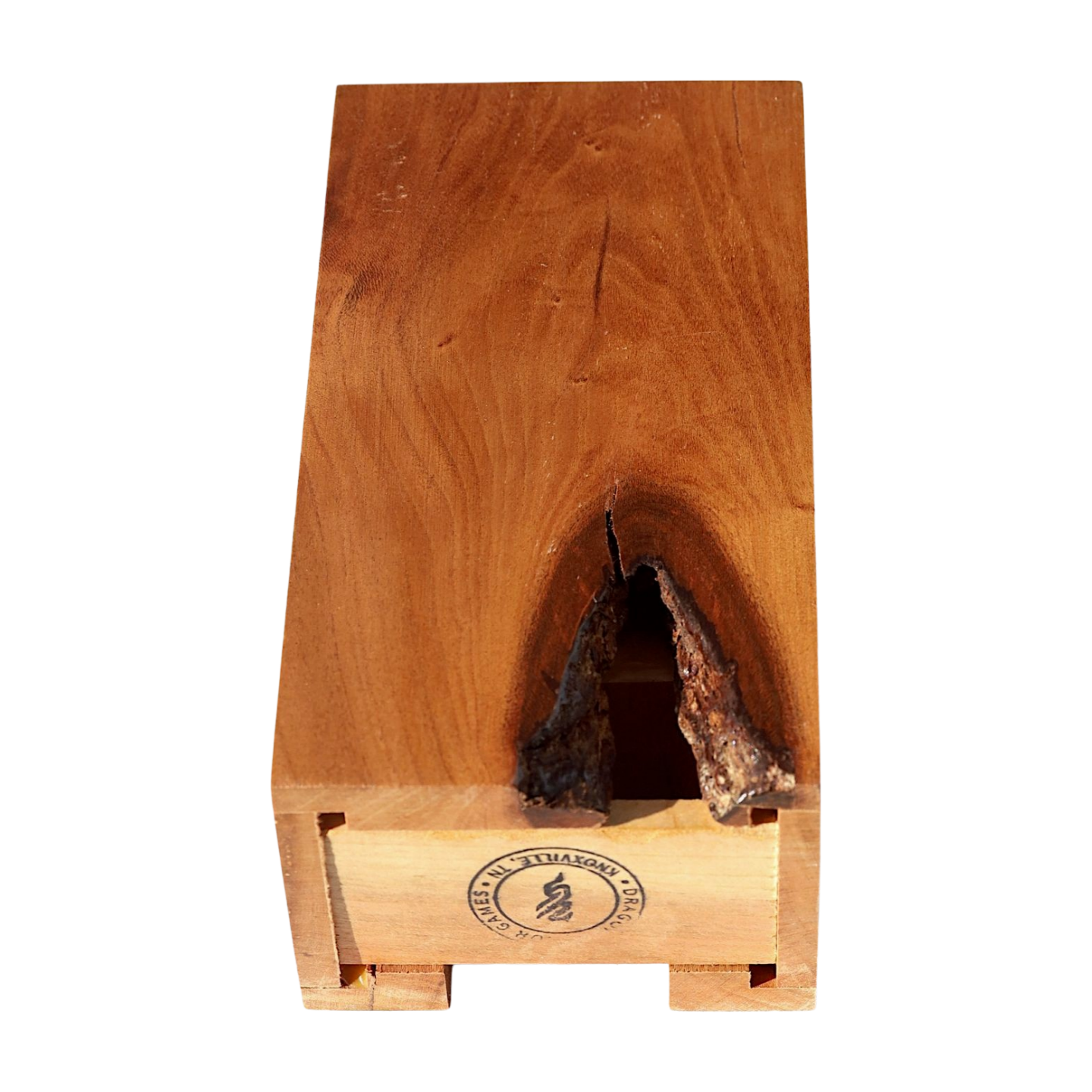 Small cherry dice tower with large knot on the back on a white background