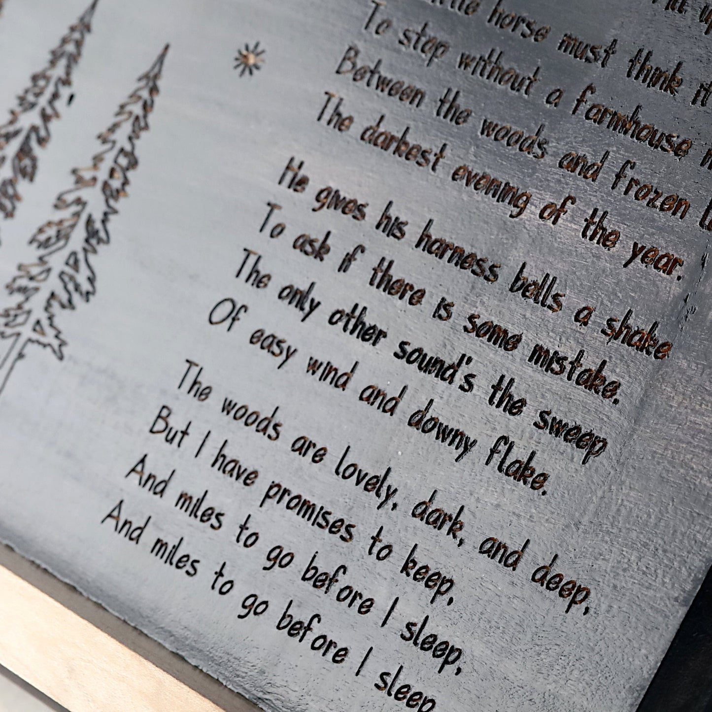 Text on a wooden surface with a snowy landscape illustration.