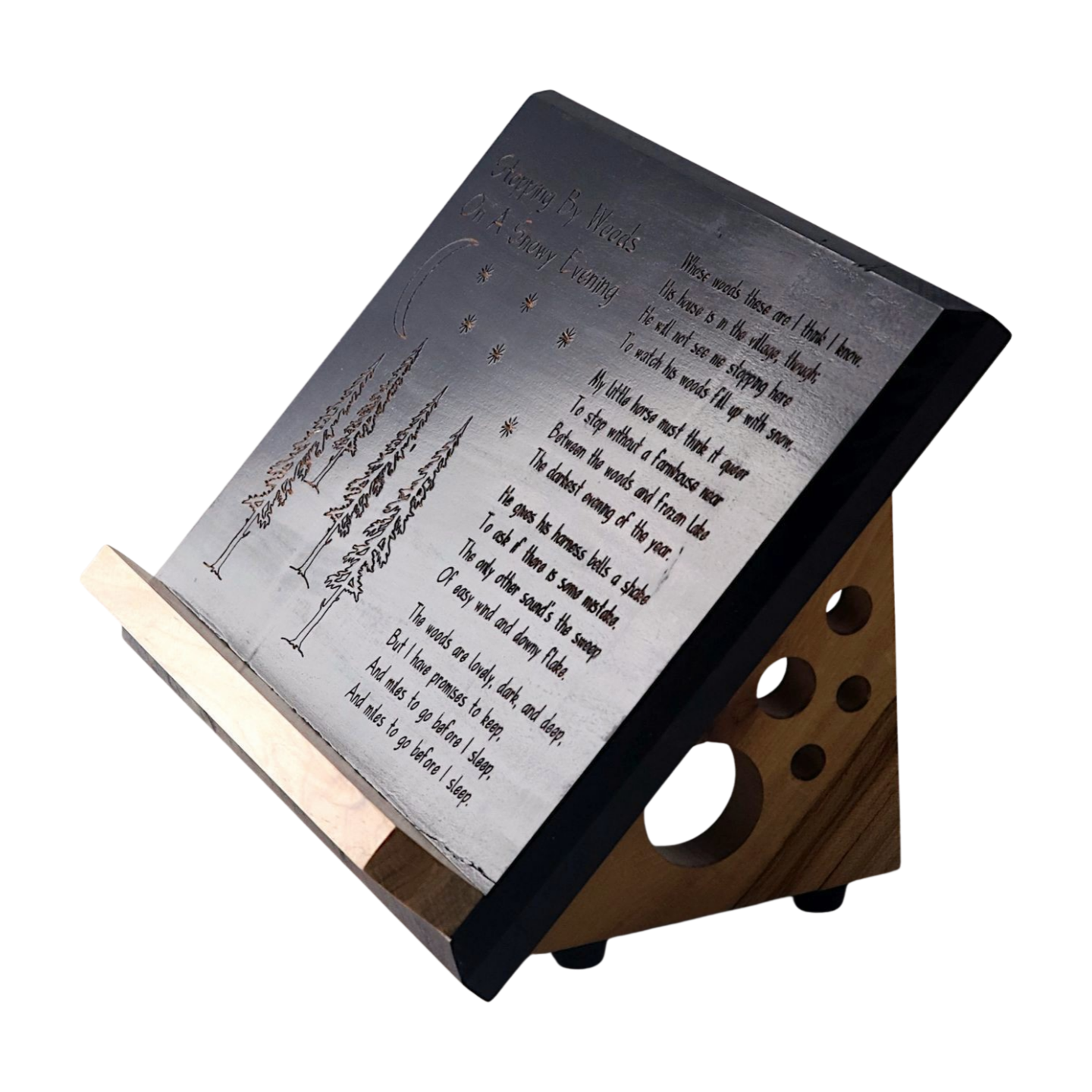 Wooden book stand with engraved text on a white background