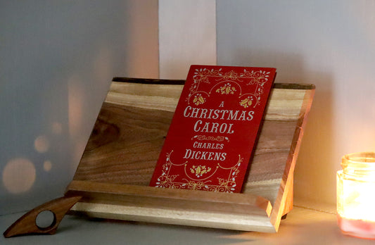 Straight live edge walnut book stand with A Christmas Carol and book page holder
